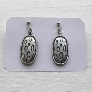 Silver Tone Textured Oval Clip Earrings